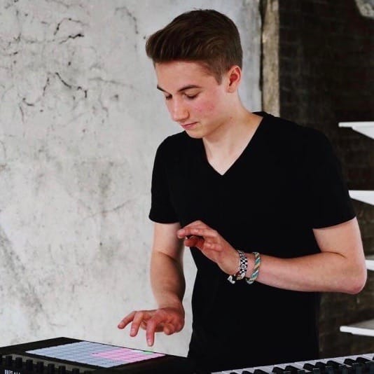 a boy playing a sample pad